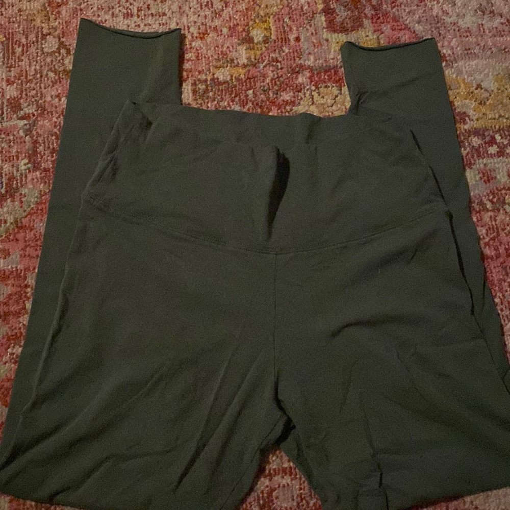 Green TNA leggings with raw ankle hem
